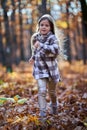 Young caucasian girl, candid autumnal portrait in the forest Royalty Free Stock Photo