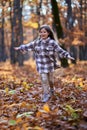 Young caucasian girl, candid autumnal portrait in the forest Royalty Free Stock Photo