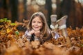 Young caucasian girl, candid autumnal portrait in the forest Royalty Free Stock Photo