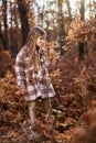 Young caucasian girl, candid autumnal portrait in the forest Royalty Free Stock Photo