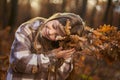 Young caucasian girl, candid autumnal portrait in the forest Royalty Free Stock Photo