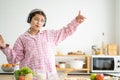 Young Caucasian girl wake up in the morning and eat fresh fruit for breakfast in the kitchen with different type of salad Royalty Free Stock Photo