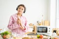 Young Caucasian girl wake up in the morning and eat fresh fruit for breakfast in the kitchen with different type of salad Royalty Free Stock Photo