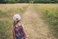 Cute girl walking on a path in rural countryside Royalty Free Stock Photo