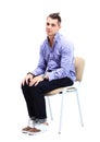 Young caucasian handsome man sitting on the chair