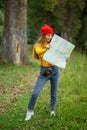 Young caucasian hiker looking at map and try to find a way