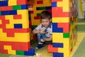 Preschooler boy happy at playroom