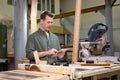 Young Caucasian Male Carpenter Using Digital Tablet, Working On Design Project Royalty Free Stock Photo