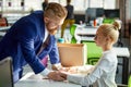 Young caucasian male director of company flirting with his young attractive secretary Royalty Free Stock Photo