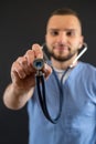 Young caucasian male doctor or nurse in blue uniform and stethoscope isolated Royalty Free Stock Photo