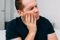 Young Caucasian male grimaces from severe toothache Royalty Free Stock Photo