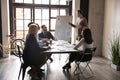 Young male speaker talk making whiteboard presentation at briefing Royalty Free Stock Photo