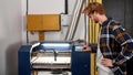 Worker or engineer operate CNC machine on factory Royalty Free Stock Photo