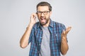 Young caucasian man angry, frustrated and furious with his phone, angry with customer service. Isolated Royalty Free Stock Photo