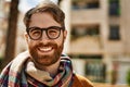 Young caucasian man with beard wearing glasses outdoors on a sunny day Royalty Free Stock Photo