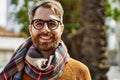 Young caucasian man with beard wearing glasses outdoors on a sunny day Royalty Free Stock Photo