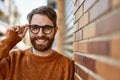 Young caucasian man with beard wearing glasses outdoors on a sunny day Royalty Free Stock Photo