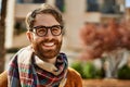 Young caucasian man with beard wearing glasses outdoors on a sunny day Royalty Free Stock Photo