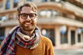 Young caucasian man with beard wearing glasses outdoors on a sunny day Royalty Free Stock Photo