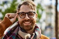 Young caucasian man with beard wearing glasses outdoors on a sunny day Royalty Free Stock Photo