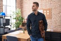 Young caucasian man business worker smiling confident holding briefcase at office Royalty Free Stock Photo