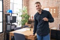 Young caucasian man business worker smiling confident holding glasses at office Royalty Free Stock Photo