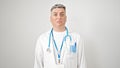 Young caucasian man doctor standing with serious expression over isolated white background Royalty Free Stock Photo