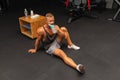 Young caucasian man drinking water after exercise.man in the gym drinking from the shaker