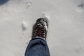 MAN`S LEG WEARING JEANS PANTS AND MOUNTAIN BOOTS