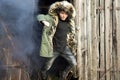 Young man posing with a smoke bomb.