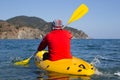 Young caucasian man kayaking in sea at Maldives Royalty Free Stock Photo