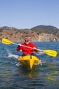 Young caucasian man kayaking in sea at Maldives Royalty Free Stock Photo