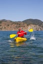 Young caucasian man kayaking in sea at Maldives Royalty Free Stock Photo