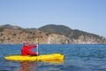 Young caucasian man kayaking in sea at Maldives Royalty Free Stock Photo