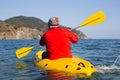 Young caucasian man kayaking in sea at Maldives Royalty Free Stock Photo