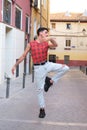 Young caucasian man with long false nails dancing at street, contemporary dance.