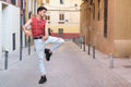 Young caucasian man with long false nails dancing at street, contemporary dance.