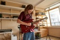 Young caucasian man play electric guitar at home Royalty Free Stock Photo