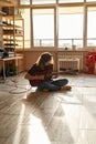 Man playing electric guitar riffs on floor at home Royalty Free Stock Photo