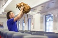 Young caucasian man putting luggage on the top Royalty Free Stock Photo