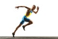 Young caucasian man running or jogging isolated on white studio background.