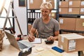 Young caucasian man smiling confident working at warehouse Royalty Free Stock Photo