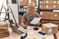 Young caucasian man smiling confident working at warehouse Royalty Free Stock Photo
