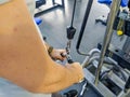 Young caucasian man starting out in a gym and checking out the equipment for body building and weight loss exercise Royalty Free Stock Photo