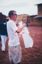 Young caucasian man volunteer wearing a white t-shirt