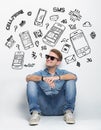 Young caucasian man wear sunglasses while sitting on the floor t