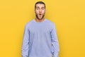 Young caucasian man wearing casual clothes afraid and shocked with surprise expression, fear and excited face Royalty Free Stock Photo