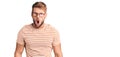 Young caucasian man wearing casual clothes and glasses afraid and shocked with surprise and amazed expression, fear and excited Royalty Free Stock Photo