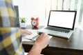 Young caucasian man working at home planning work writing note o Royalty Free Stock Photo