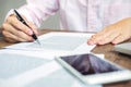 young caucasian man working at home planning work writing note on some project with his laptop on a desk, strartup business, e Royalty Free Stock Photo